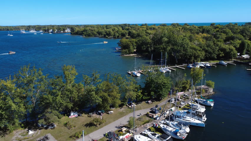 Cinematic aerial drone footage of Toronto Island marina in Toronto, Canada. Captured in 4K UHD ProRes with smooth motion, showcasing boats, waterfront, and natural scenery.