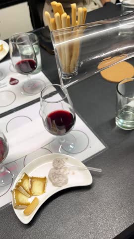 A Wine Expert Fills a Glass from a decanting vessel