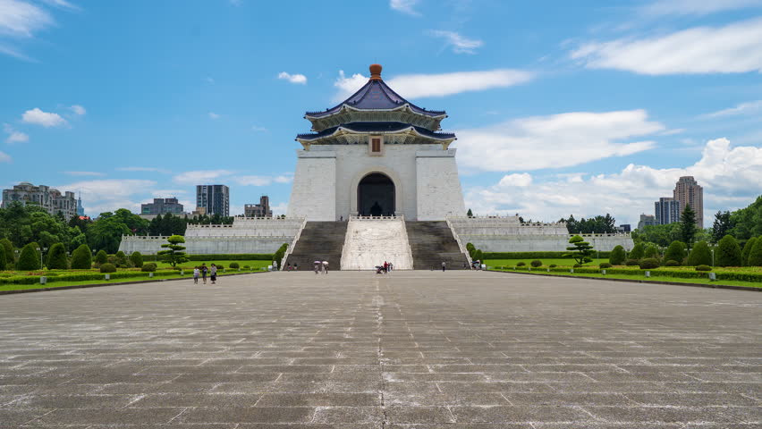 Chiang Kai-shek Memorial Hall in the morning with Taipei 101 in the background in Taipei, Taiwan. The Chinese characters on the plaque read "Chiang Kai-shek Memorial Hall".
