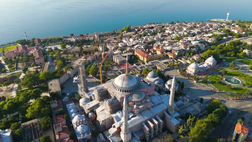 Istanbul, Turkey. Panoramic drone flight over Fatih district featuring Hagia Sophia and Sea of Marmara at sunrise, Aerial View, MasterShots, Rocket