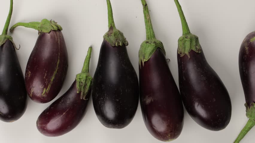 harvest of organic eggplants food background zoom
