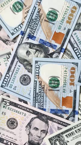 USA money, cash paper dollars, american business and financial transactions. Cash dollars in bills of different denominations as a conceptual background