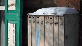 Macro close-up of ancient steel mailboxes from Tsarist era on historic wooden house. Authentic carved details with peeling paint, winter atmosphere evoking real life memories and past nostalgia - Powered by Shutterstock - Get 15% off with code: PIKWIZARD15