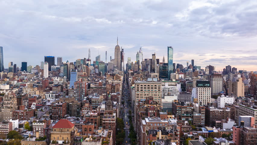 Aerial hyperlapse showing iconic skyline of Midtown Manhattan, New York City. Empire State Building stands in the background