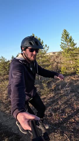 An engaging first-person view for social media stories or reels. A man on a unicycle symbolizes a unique journey, perfect for marketing content.