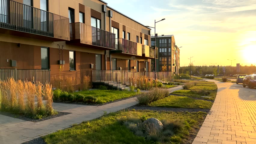 Modern Residential Building at Sunrise in Tranquil Neighborhood. Duplex Townhouse at Lush Greenery and Pathways. Enjoy peaceful morning in contemporary apartment complex. Walkway