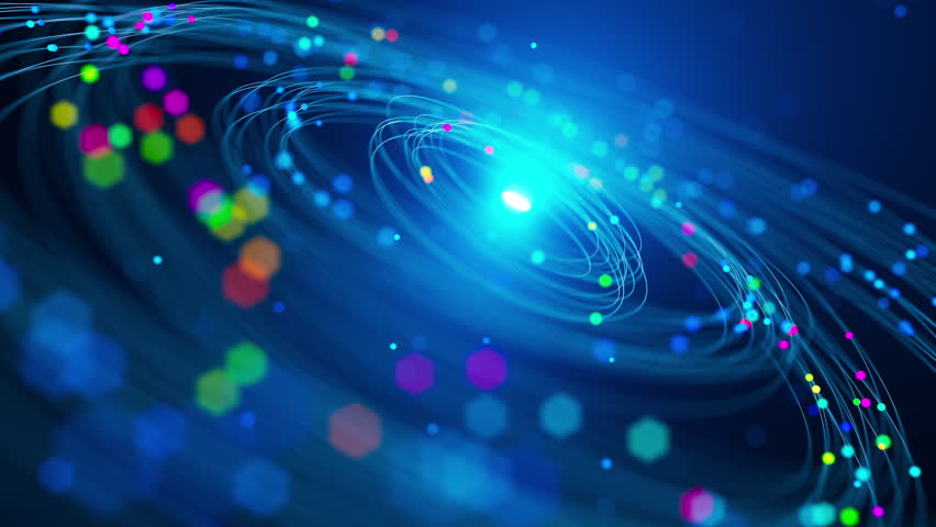 Abstract seamless loop showing neon light paths and vivid particles rotating around a central glow, symbolizing cosmic energy, futuristic motion, and digital dynamics.