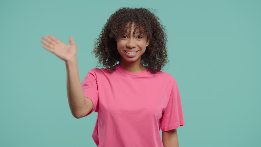 Curly Woman waving hand - hello, salute, chao, adios. Parting, say bye to camera