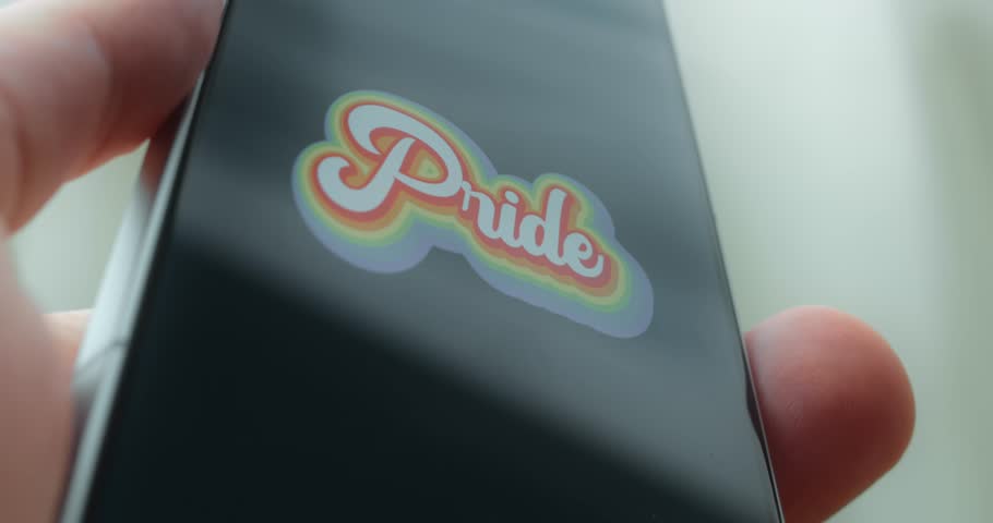 Pride sticker with rainbow colored lettering, LGBTQ flag colors, presentation