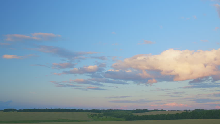 A Beautiful Sky Displaying Stunning Colors Over Lush Fields at Dusk, Captivating All Who See It