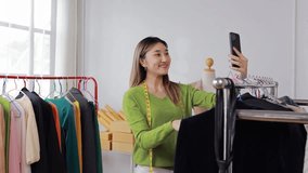 Fashion designer skillfully showcasing clothing line through smartphone while working in personal workshop, capturing creative entrepreneurial spirit of modern small business professional - Powered by Shutterstock - Get 15% off with code: PIKWIZARD15