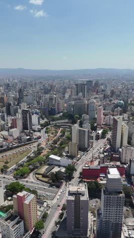 Panoramic aerial view of São Paulo, Brazil, with skyscrapers, highways, and urban sprawl under clear sky, showing the dynamic energy of South America’s largest city.