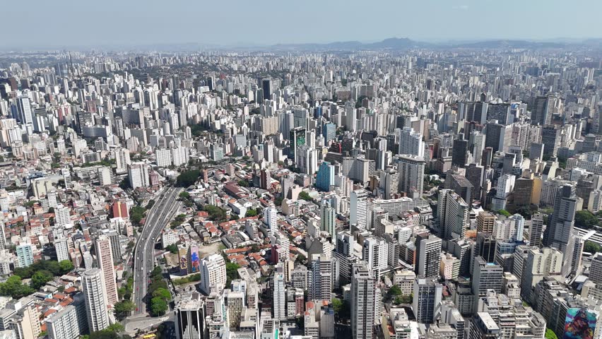 Aerial drone 4K view of São Paulo, Brazil, with its vast skyline, busy streets, and iconic skyscrapers. A breathtaking perspective of one of the world’s largest urban centers