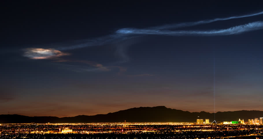 Lingering exhaust particles from SpaceX and Falcon 9 rocket launch hovers above Las Vegas at twilight from Earth’s mesosphere.