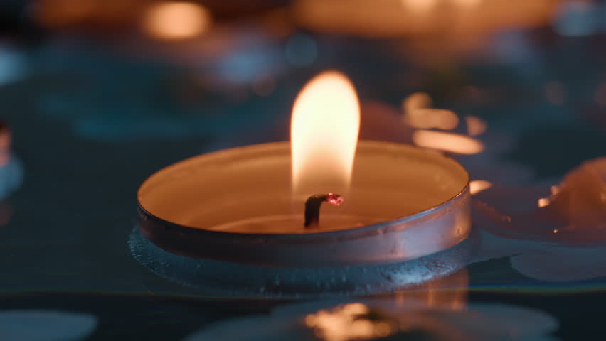 Candle floats in river for the religious festival of Diwali