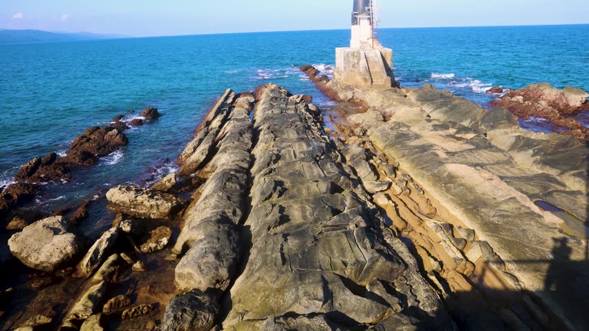 iconic light house of andaman ross island with blue sea water horizon and rocky shore at day video is taken at ross island Port Blair in Andaman and Nicobar Island, India.