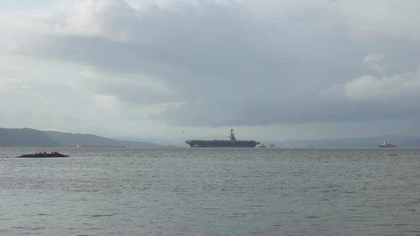 Navigating Aircraft Carrier USS Gerald R. Ford In Oslo Fjord, Oslo, Norway. Aerial Shot