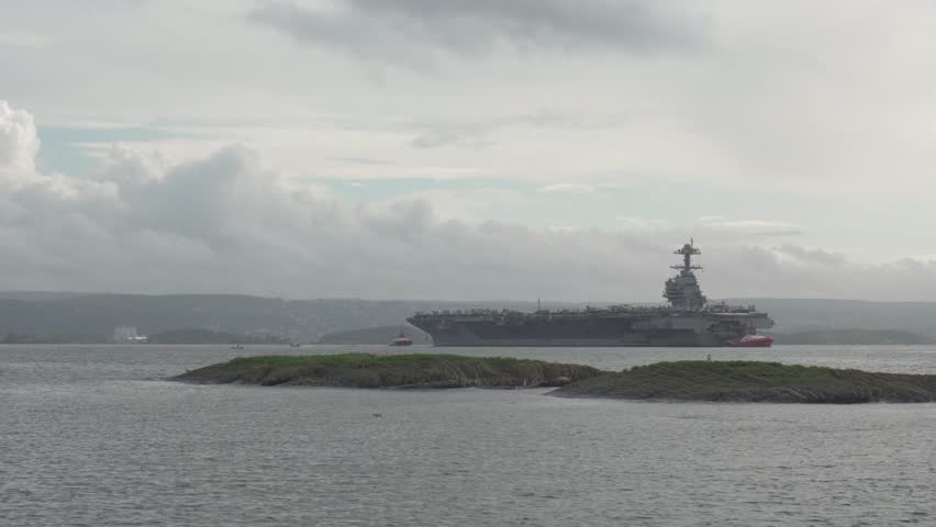Helicopter Fly Over The USS Gerald R. Ford In Oslo Fjord, Oslo, Norway. - wide shot