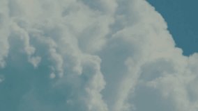 Dramatic time-lapse of fluffy white clouds forming and moving across a bright blue sky, showcasing natural beauty, peaceful atmosphere, and ever-changing weather patterns. - Powered by Shutterstock - Get 15% off with code: PIKWIZARD15