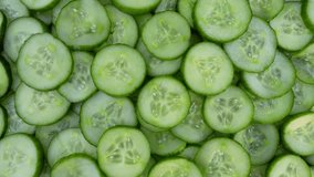 Fresh cucumber slices rotating top view. Healthy food.  - Powered by Shutterstock - Get 15% off with code: PIKWIZARD15