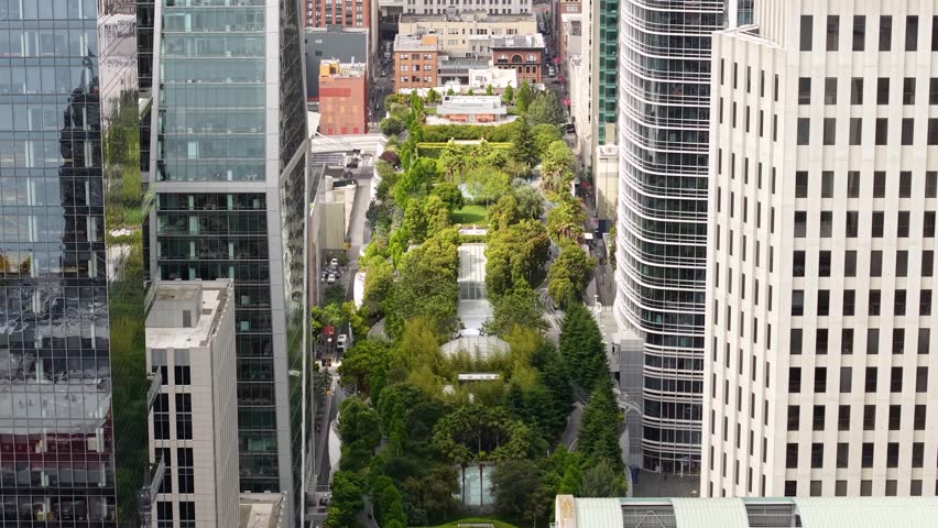 Drone Shot of Salesforce Park Between Skyscrapers of Downtown San Francisco USA, Elevated Gardens and Buildings