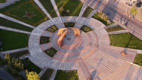 Eternal Flame At Victory Square Dedicated To The Victory During The WWII In Bishkek, Kyrgyzstan. - aerial shot - Powered by Shutterstock - Get 15% off with code: PIKWIZARD15