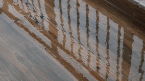 Rainwater collects on wooden surface creating tranquil reflections - Powered by Shutterstock - Get 15% off with code: PIKWIZARD15