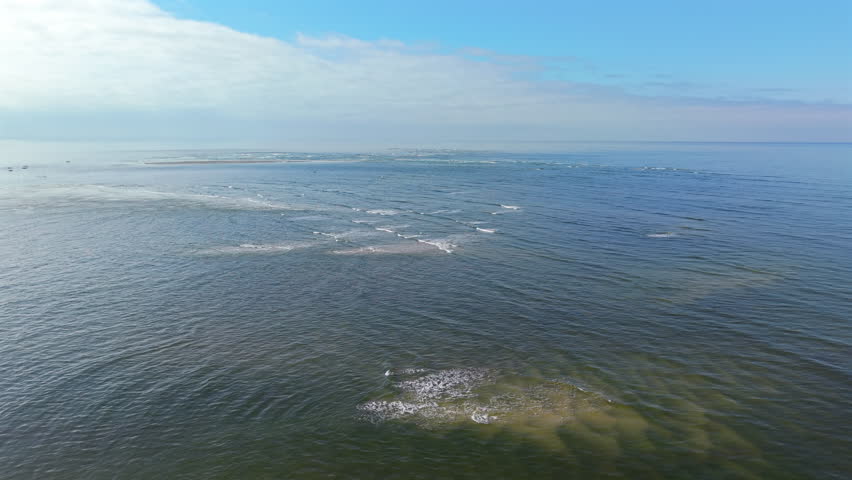 Aerial peaceful landscape of Sandbanks emerging from the sea at Praia de Caieiras, Guaratuba, Paraná, Brazil