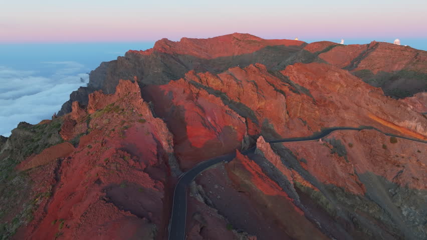 Aerial sunrise view of Caldera de Taburiente in La Palma. Dramatic aerial perspective of the volcanic crater and mountain peaks during a colorful sunrise