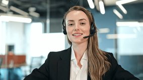 Cheerful professional businesswoman, wearing a black suit and white shirt with headset, speaks confidently to the camera in a modern office. Smiling female agent providing excellent customer service. - Powered by Shutterstock - Get 15% off with code: PIKWIZARD15
