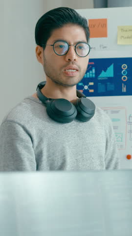 Vertical Screen : Group adult Asia male female software developers mentor leader manager talk strategy plan executive write prompt AI bot app nomad, video game, data center. Whiteboard slideshow code.