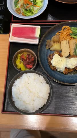 4k footage, close up of Japanese cuisine of Chicken nanban and Japanese curry served with Miso soup, bowl of rice, and salad. Japanese food theme.