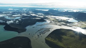 Aerial view of the braided river system cutting through the Icelandic landscape with mountains and lakes in the background, Fjallabak Nature Reserve, Rangárþing ytra, Iceland. - Powered by Shutterstock - Get 15% off with code: PIKWIZARD15