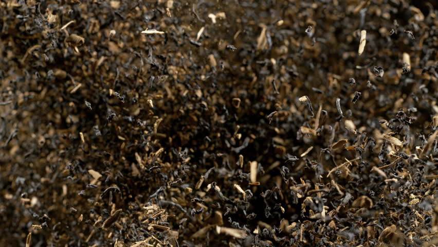 Super Slow Motion Shot of Flying Tea Mix Isolated on Black Background at 1000fps.