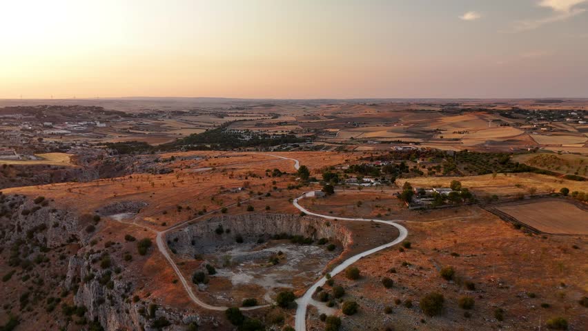 Aerial Sunset View of Rocky Landscape and Farmland near Matera, Basilicata, Southern Italy – Scenic Countryside Panorama