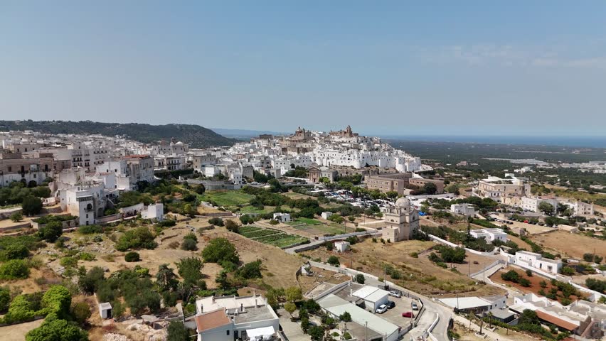 Scenic Aerial Footage of Ostuni, the White Hilltop Town in Southern Italy Surrounded by Historic Architecture