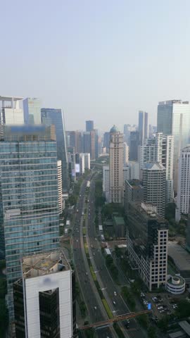 Aerial view of Jakarta central business district with modern skyscrapers and traffic, showcasing Indonesia