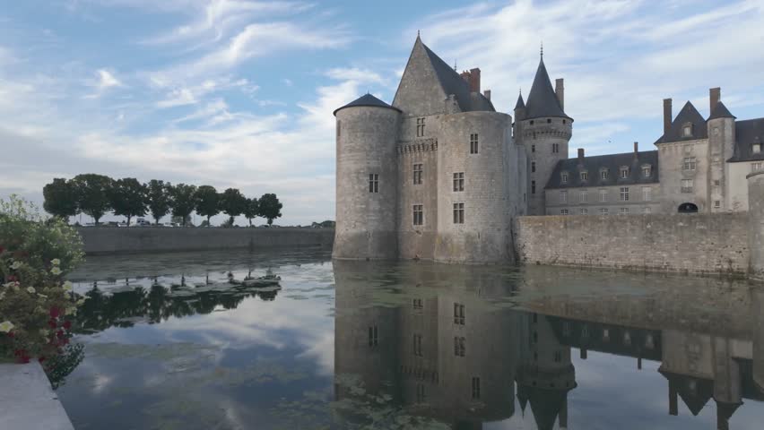 French Loire Valley Château de Sully-sur-Loire with medieval architecture and trees