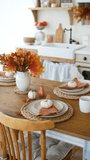 Autumn table setting with colorful maple leaves and mini pumpkins on plates - Powered by Shutterstock - Get 15% off with code: PIKWIZARD15