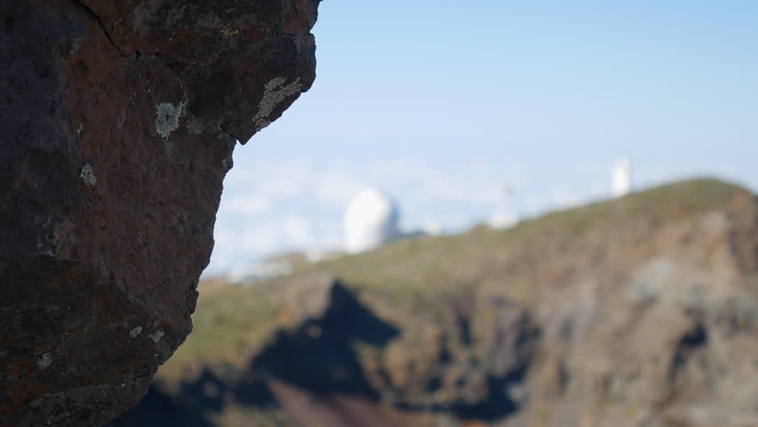 Astrophysical observatory telescopes on a volcanic mountain above the clouds on La Palma island. Roque de los Muchachos.