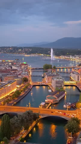 Experience the beauty of Genevas at twilight, as it illuminates the tranquil lake