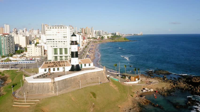 The farol da barra lighthouse stands tall against the cityscape of salvador, brazil