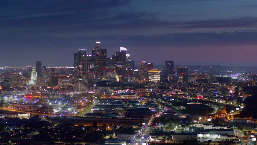 The city lights illuminate the los angeles skyline at night