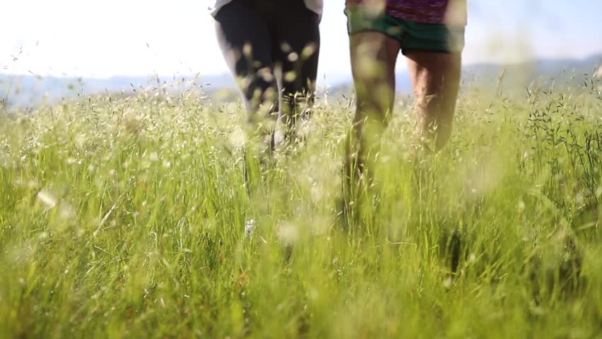 Group of people running on a meadow. Sport, grass, run, healthy lifestyle concept. 