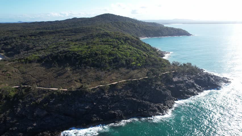 Cruising Across The Granite Bay Rocky Shoreline In Noosa Heads, Queensland, Australia. Aerial Drone Shot