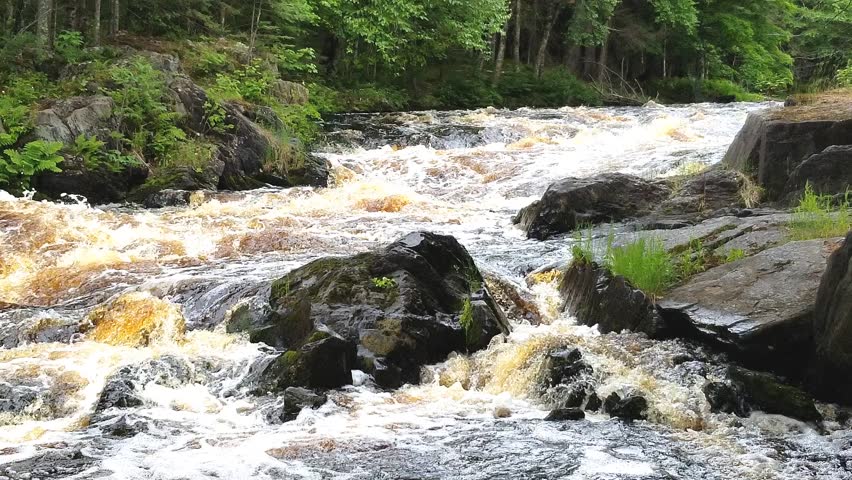 Meyer’s Falls waterfall cascading over rugged rock ledges in Florence County, Wisconsin, surrounded by lush forest scenery and flowing water in a natural setting.