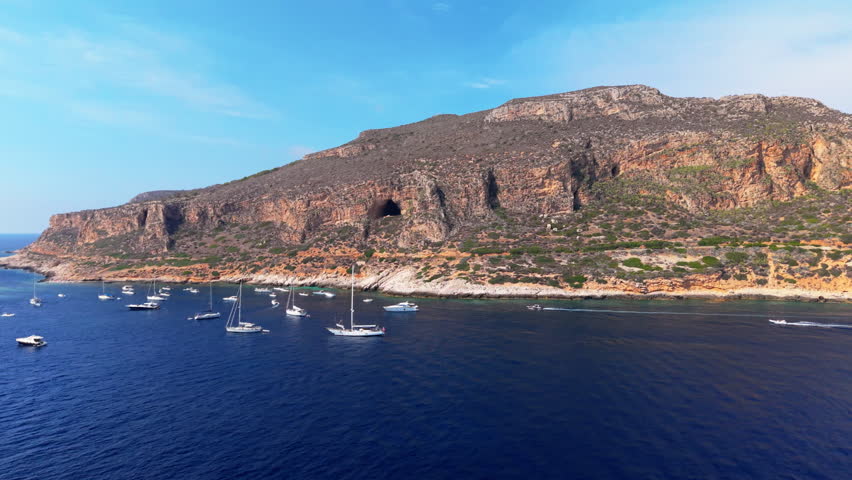 Stunning Sicily coastline with boats, blue sky, sense of tranquility