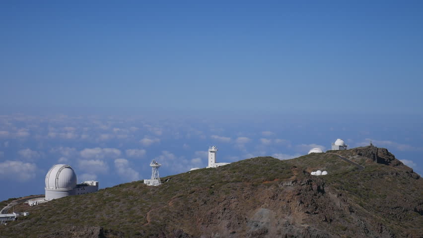 Telescopes of the Roque de Los Muchachos Astrophysical Observatory above the clouds in La Palma