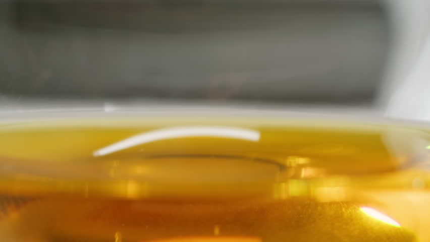 Pouring olive linen oil sunflower in different dishes close-up. Using in cooking for frying foods or as a salad dressing omega 3. Olive oil is popular supplement for meals and salads. 