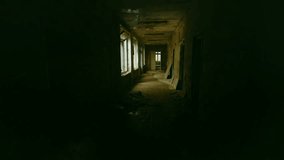 Eerie and atmospheric footage captures the desolate interior of an abandoned school in Pripyat, located within the Chernobyl Exclusion Zone. The long, dark corridor with broken windows and debris on t - Powered by Shutterstock - Get 15% off with code: PIKWIZARD15